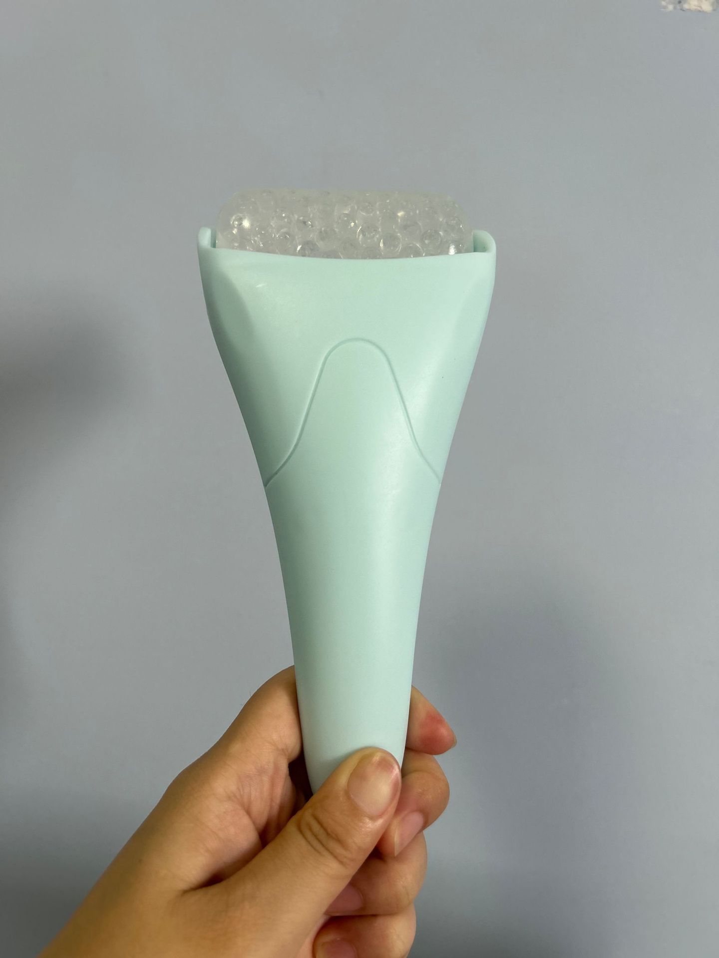 Pink Ergonomic Facial Ice Roller for Skincare and Wellness