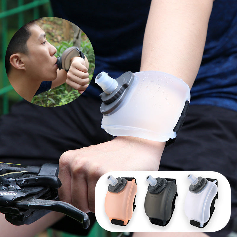 Wearable water bottle in translucent white, black, and peach, wrist-mounted for easy hydration