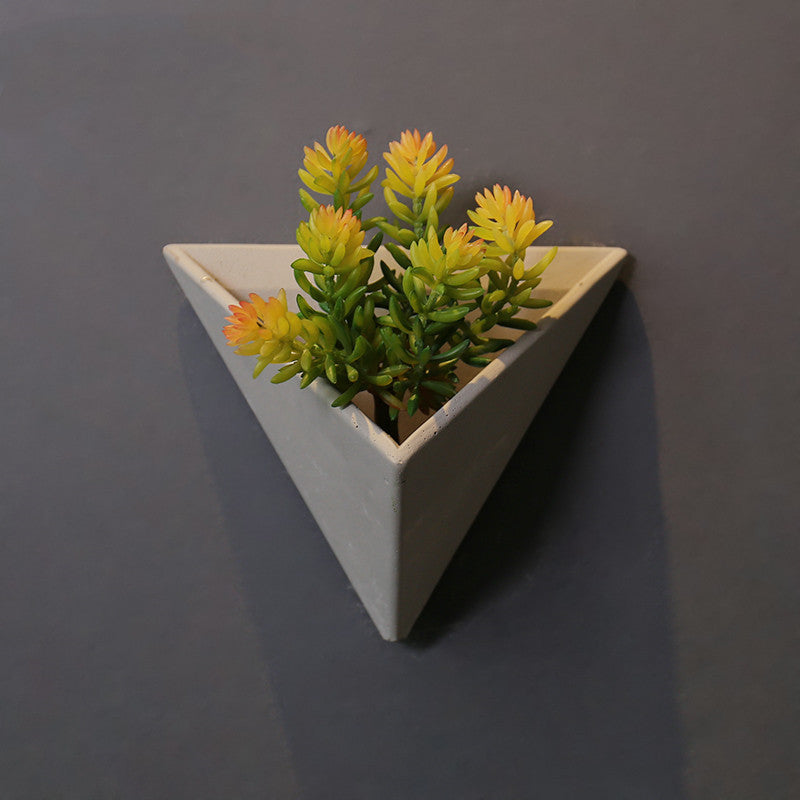 Eco-Friendly Triangular Wall-Mounted Planter for Indoor Greenery