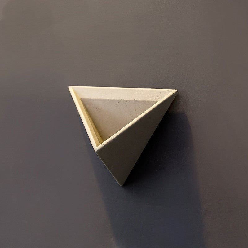 Eco-Friendly Triangular Wall-Mounted Planter for Indoor Greenery