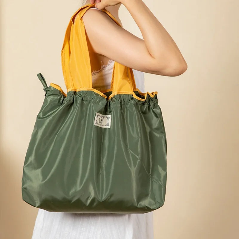 Turquoise Reusable Tote Bag with Orange Handles - Eco-Friendly Shopping Solution