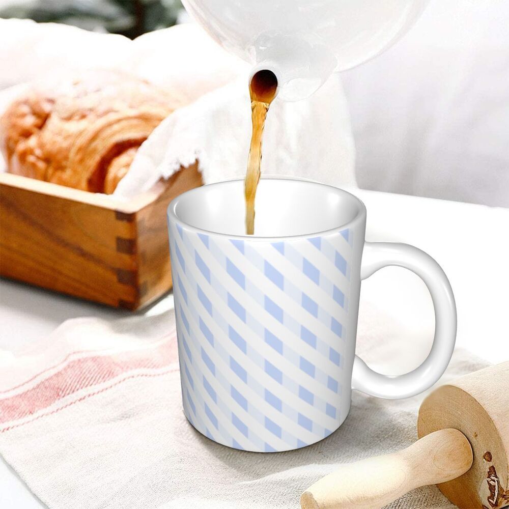 White ceramic mug with light blue diagonal stripes