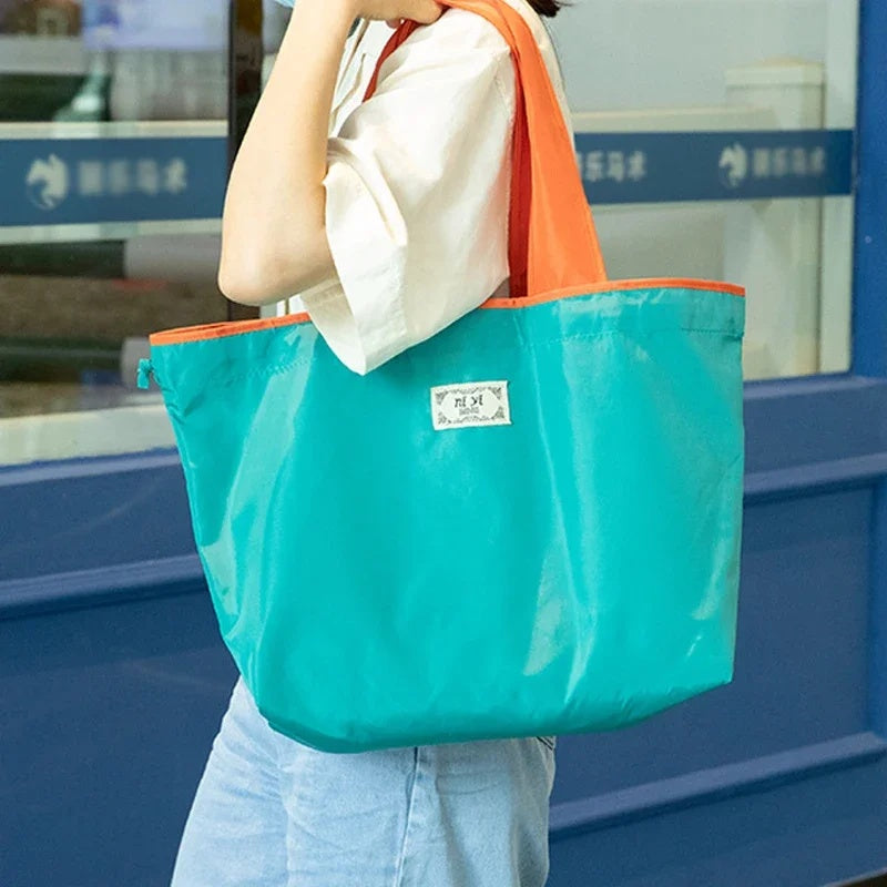 Turquoise Reusable Tote Bag with Orange Handles - Eco-Friendly Shopping Solution
