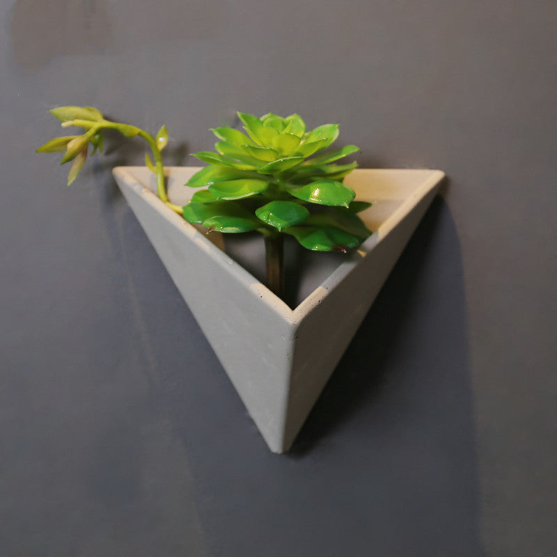 Eco-Friendly Triangular Wall-Mounted Planter for Indoor Greenery