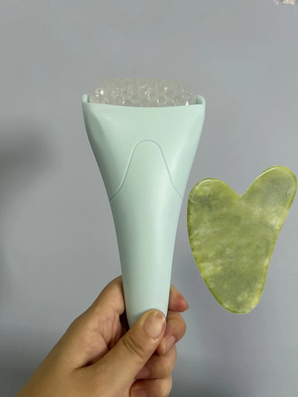 Pink Ergonomic Facial Ice Roller for Skincare and Wellness