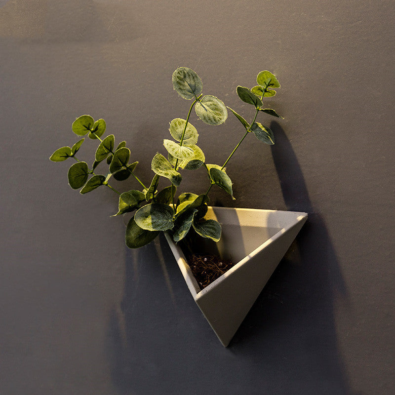 Eco-Friendly Triangular Wall-Mounted Planter for Indoor Greenery