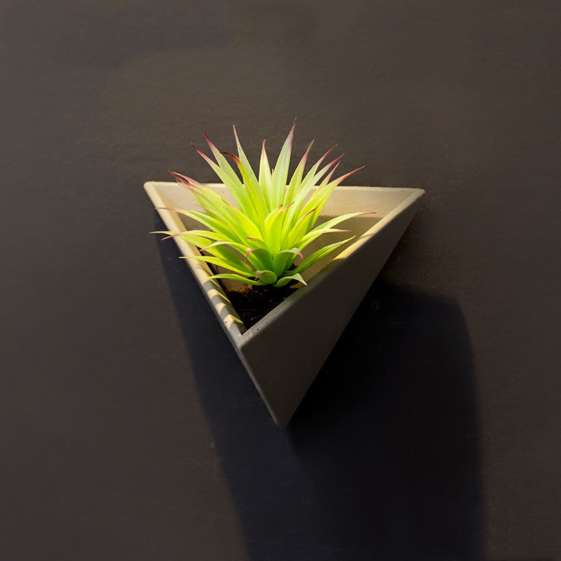 Eco-Friendly Triangular Wall-Mounted Planter for Indoor Greenery