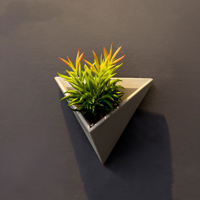 Eco-Friendly Triangular Wall-Mounted Planter for Indoor Greenery