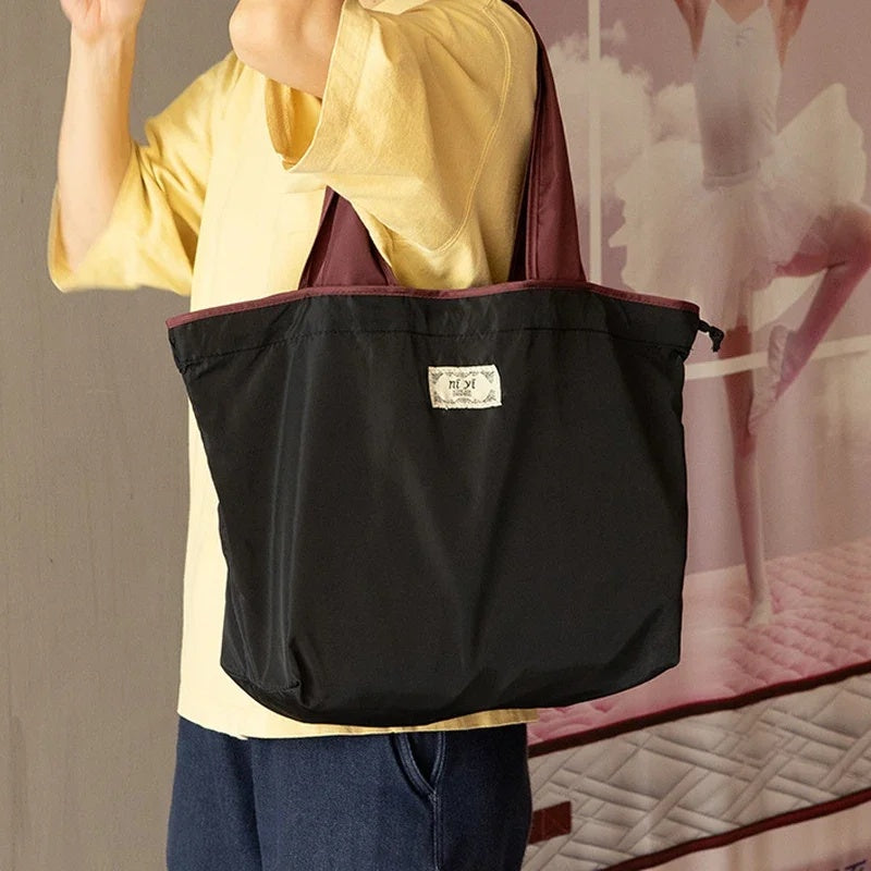 Turquoise Reusable Tote Bag with Orange Handles - Eco-Friendly Shopping Solution