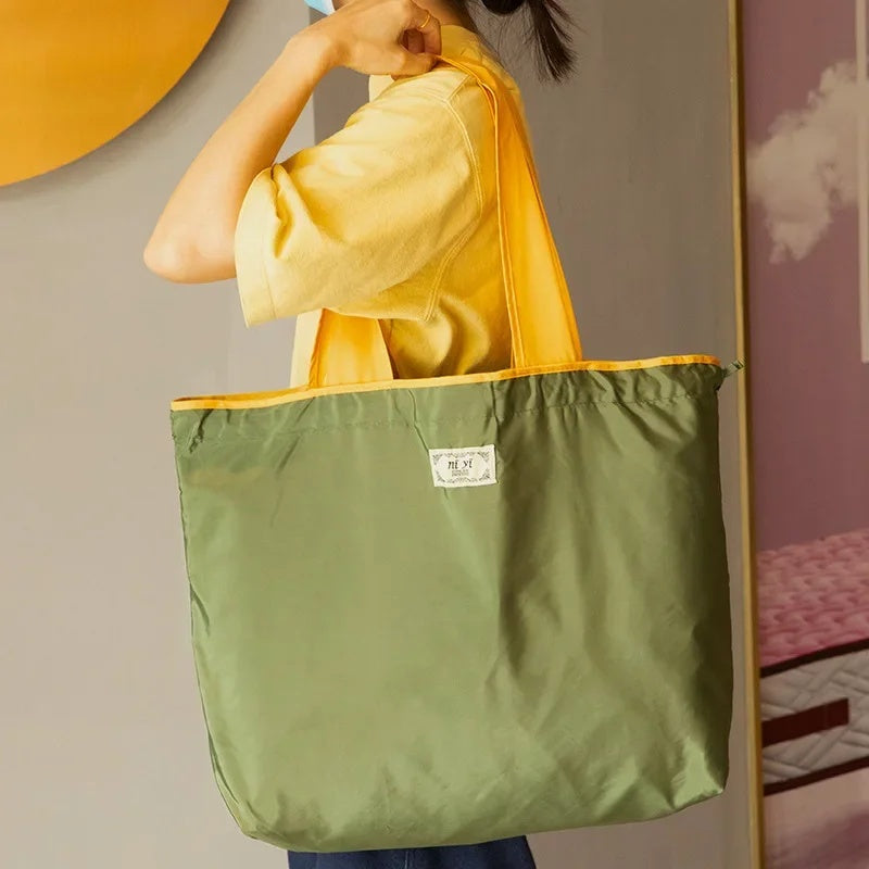 Turquoise Reusable Tote Bag with Orange Handles - Eco-Friendly Shopping Solution