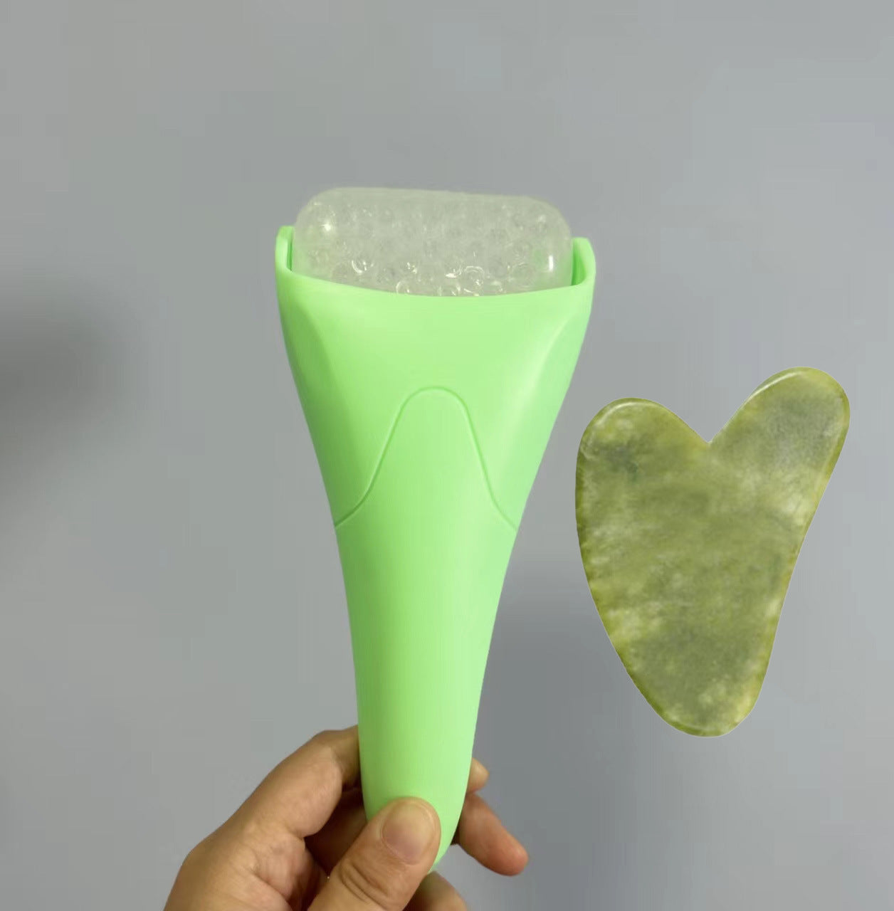 Pink Ergonomic Facial Ice Roller for Skincare and Wellness