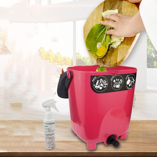 Pink kitchen compost bin with odor control spray bottle