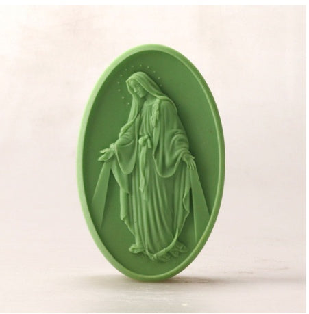 Light green oval soap bar with natural ingredients