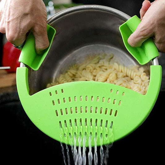Green silicone clip-on pot strainer for eco-friendly kitchen use