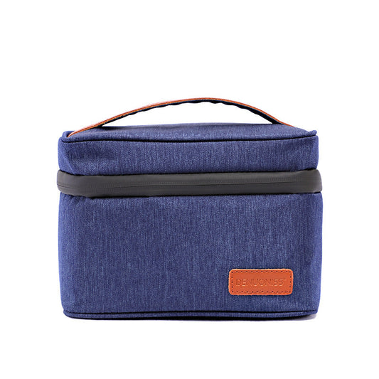 Blue canvas toiletry bag with brown accents