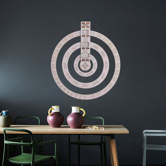 Light pink circular perpetual wall calendar with concentric rings