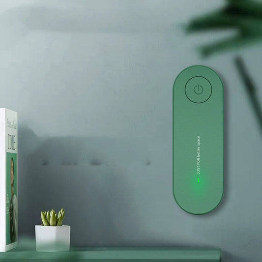 Green wall-mounted air purifier with rounded edges