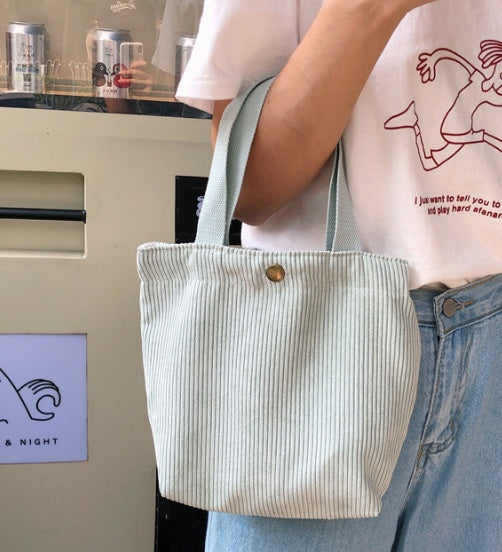 Light gray eco-friendly tote bag with a flat bottom