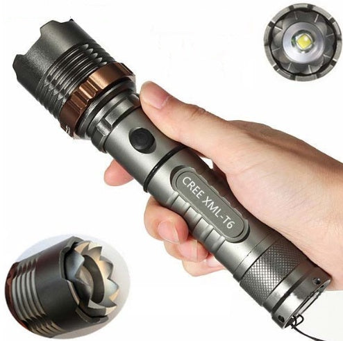 Metallic gray flashlight with copper accents and textured grip