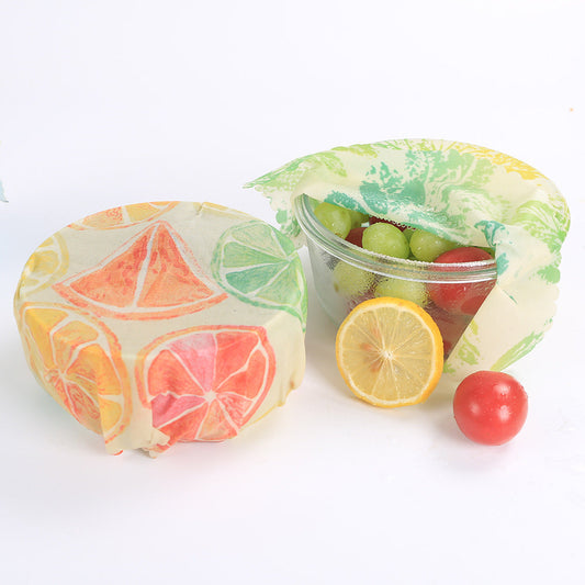 Multicolored reusable beeswax food wraps with fruit patterns