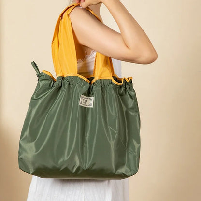 Turquoise Reusable Tote Bag with Orange Handles - Eco-Friendly Shopping Solution