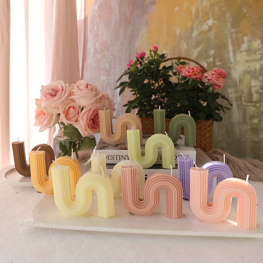 Pastel Curved Candles in Various Shapes and Colors