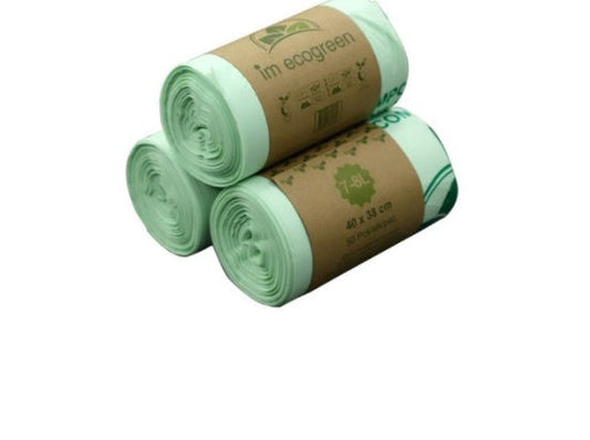 Light green biodegradable trash bags in cylindrical rolls with cardboard sleeve packaging