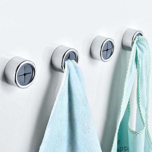 Circular wall-mounted towel holder in silver with black accents