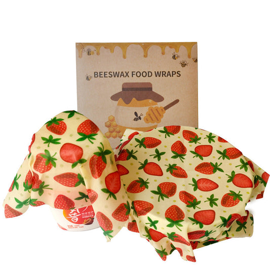 Yellow beeswax food wraps with red strawberry pattern