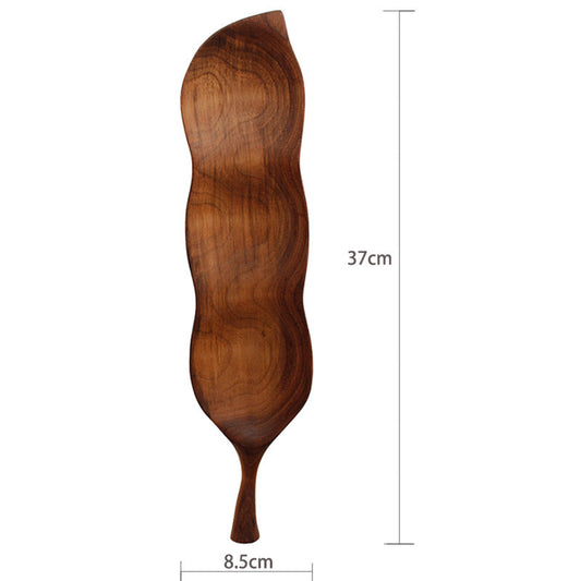Leaf-shaped wooden serving tray in natural wood tone