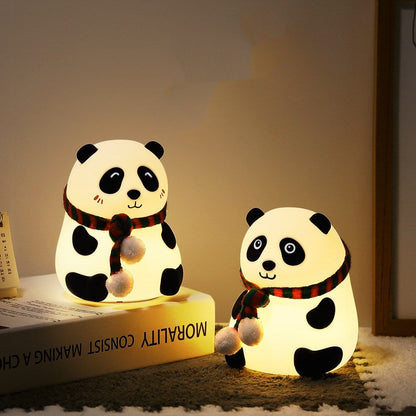 Panda-shaped LED night light in white with black accents