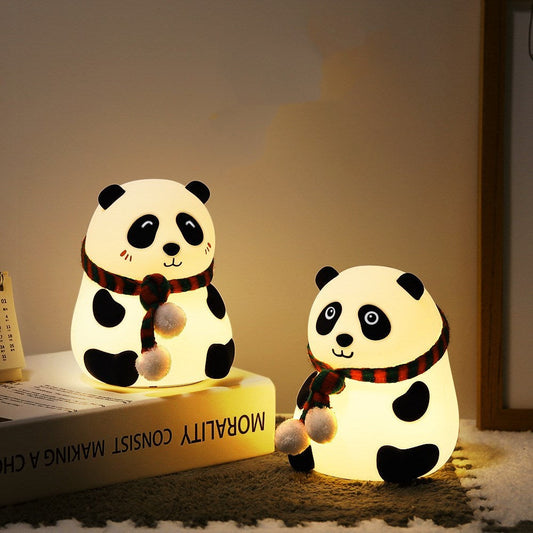 Panda-shaped LED night light in white with black accents
