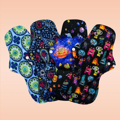 Multicolored reusable cloth menstrual pads with floral, space, and cartoon designs