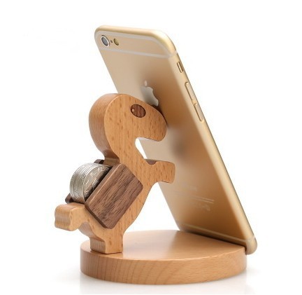 Dinosaur-shaped wooden phone stand in natural wood tones