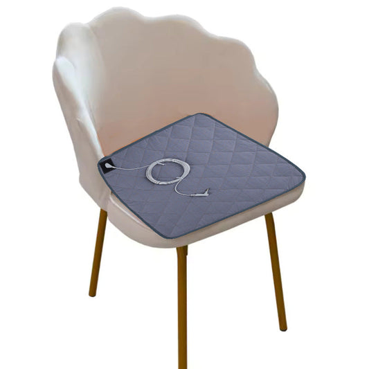 Gray energy-efficient heated seat cushion on a chair