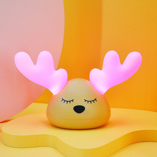 Yellow base night light with pink antlers
