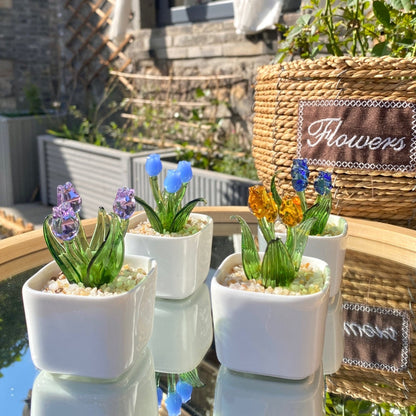 Eco-friendly glass flower arrangement in ceramic pots