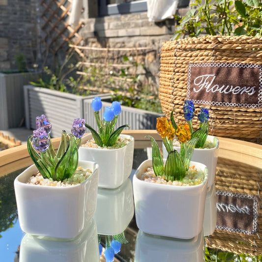 Eco-friendly glass flower arrangement in ceramic pots