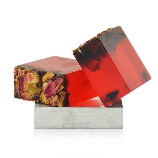 Luxurious handmade red soap with floral inclusions