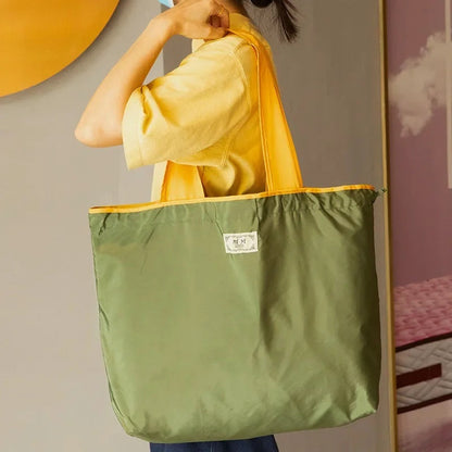 Turquoise Reusable Tote Bag with Orange Handles - Eco-Friendly Shopping Solution
