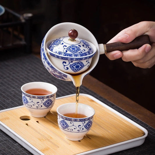 White ceramic teapot and teacup set with blue patterns