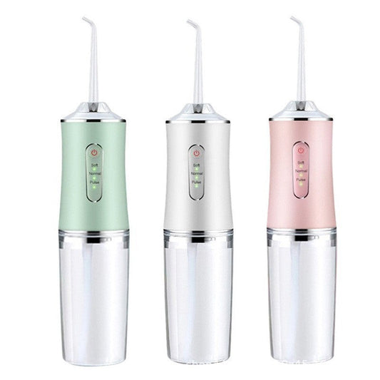 Eco-Friendly Portable Water Flosser in Green, White, and Pink