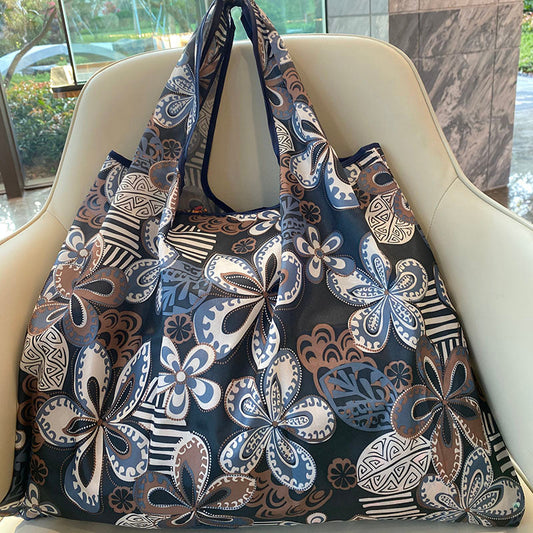 Multicolored reusable shopping bag with floral and geometric patterns
